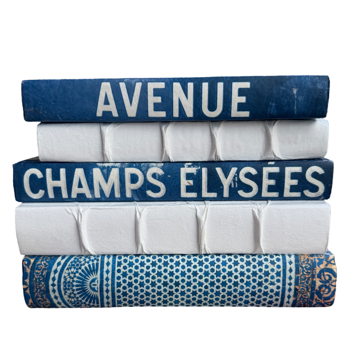 Stack of books with decorative covers on a white background