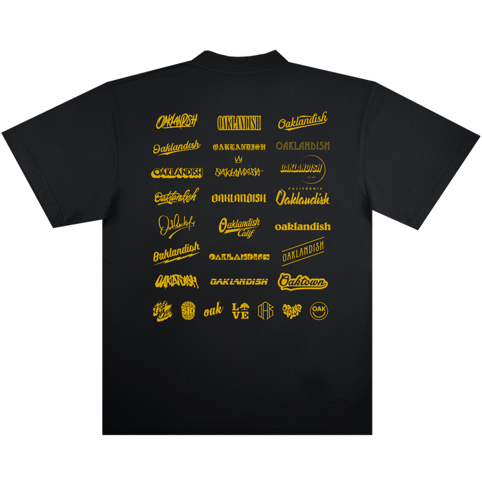 The Other 25 Years Tee features 27 “Oaklandish” logos in a mix of yellow and gold fonts and styles, arranged in five rows on the back. Designed to celebrate community culture and the Oaklandish 25th Anniversary, this black tee stands out against a white background, highlighting both the shirt itself and its iconic logo designs.