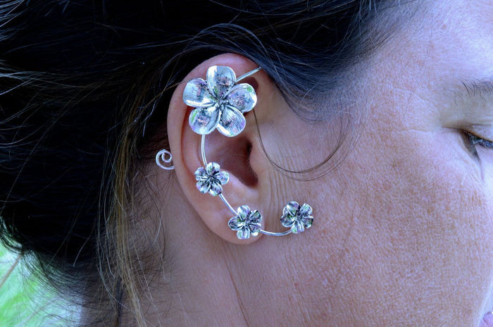 Model wearing Silver Plumeria Elf Cuff Earrings festival style