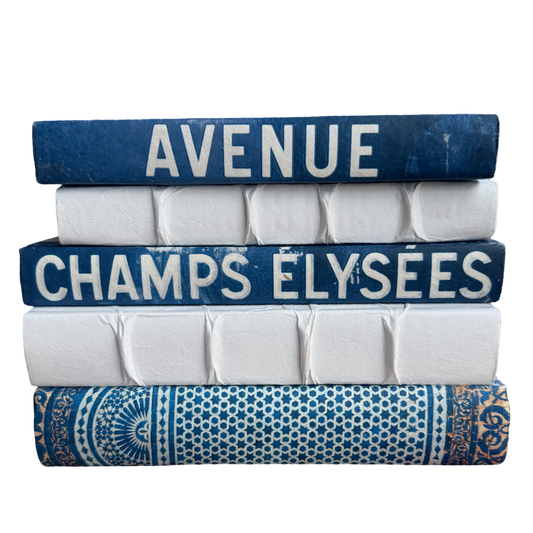 Stack of books with decorative covers on a white background