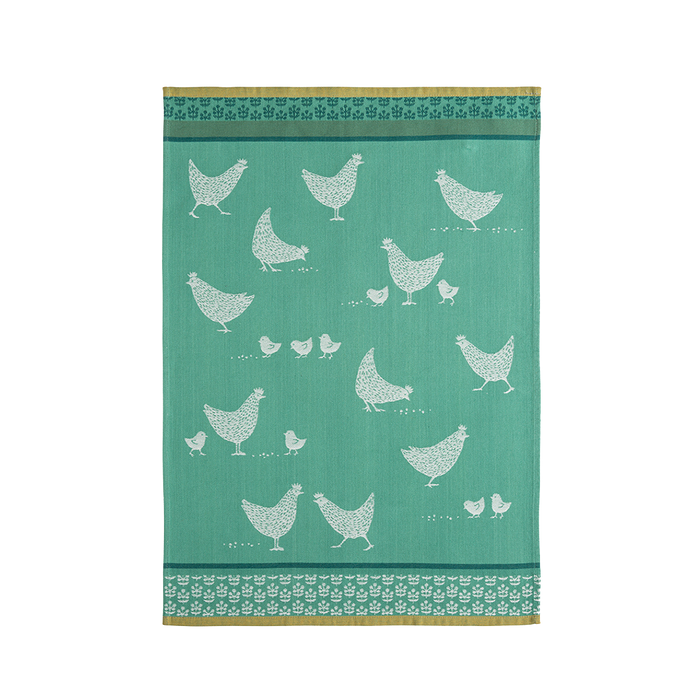 A green cotton tea towel with white chicken patterns and a decorative border.