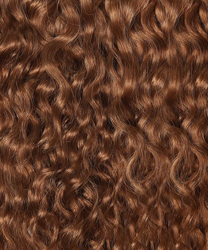 Close-up of long, tightly coiled Golden Brown  curls with a shiny, healthy look and well-defined, layered natural style.#color_golden-brown-(6)