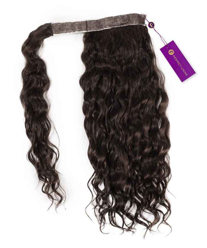 A Curly Clip-In Ponytail Extension by Perfect Locks in Natural Black  on a white background with a fabric band and purple tag.#color_natural-black-(1B)