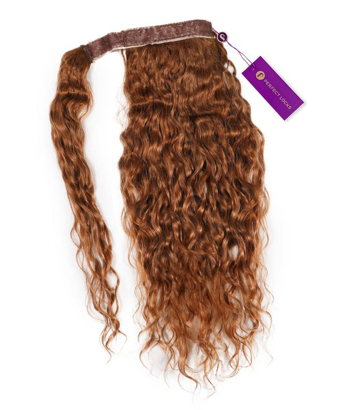A single Curly Clip-In Ponytail Extension by Perfect Locks in Golden Brown , with a brown band and purple tag on white background.#color_golden-brown-(6)