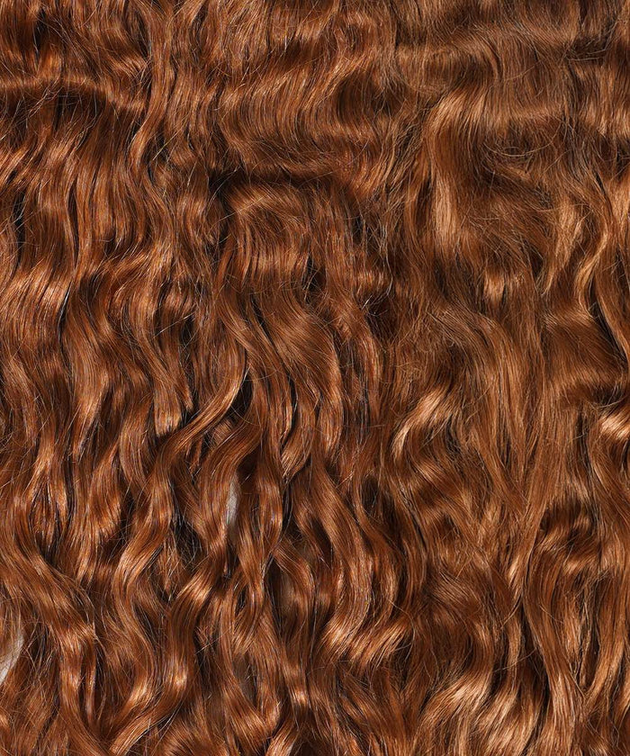 Close-up of Perfect Locks Curly Clip-In Ponytail Extensions in Honey Blonde , with long, wavy hair and defined curls.#color_golden-brown-(6)