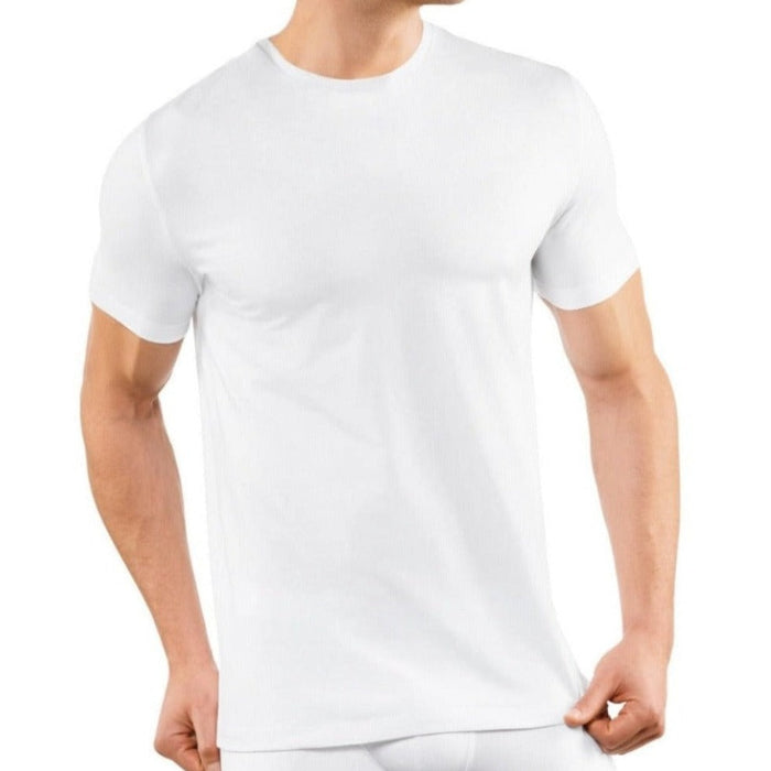 A man wearing a Falke Men Underwear Crew Neck T-Shirt 2-Pack from KirbyAllison.com, made of Egyptian cotton and in white color.