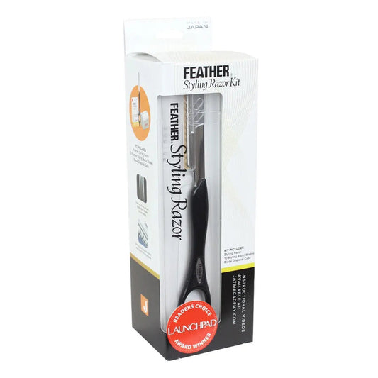 “Stylist holding the Feather Styling Razor, demonstrating its balanced, ergonomic design”