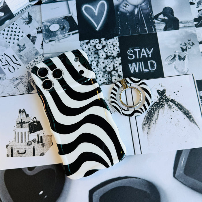 Fifth Ave. Flow monochromatic fluid wave pattern MagSafe phone grip ring with black and white swirling design compatible with iPhone and Samsung
