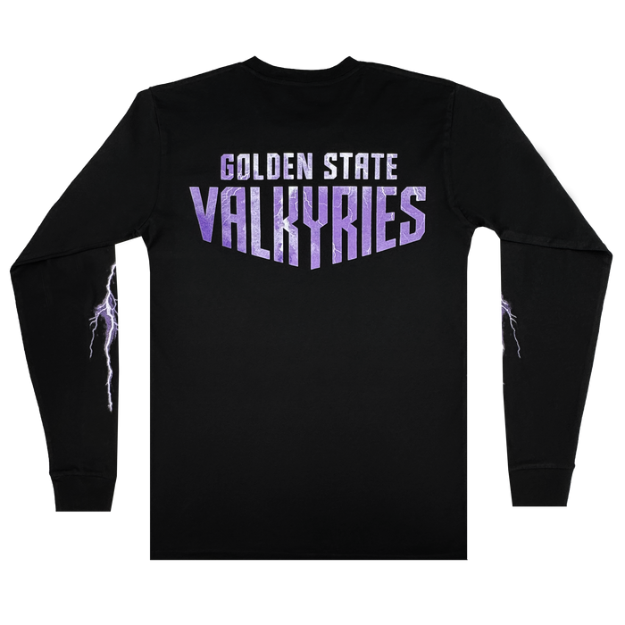 The GSV Golden State Valkyries Violet Lightning LS Tee is a black organic cotton long sleeve, with “GOLDEN STATE” in white and “VALKYRIES” in bold purple on the back. White and purple lightning bolts run down each sleeve.