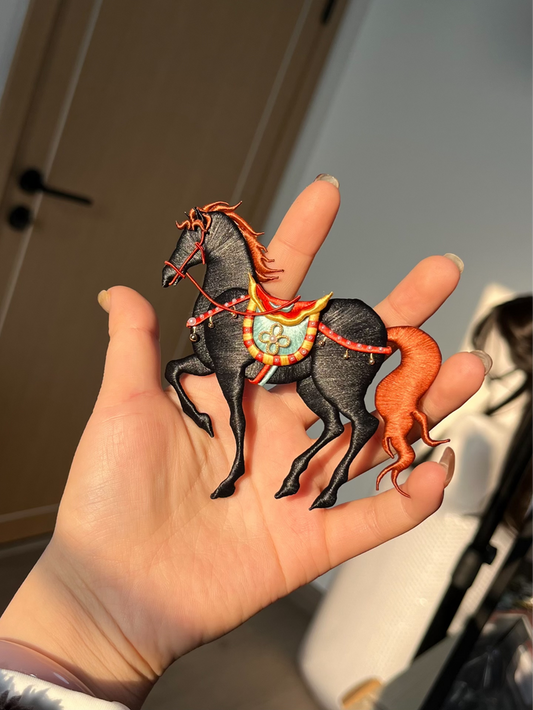A hand - held handmade Chanhua horse ornament with a black body and orange mane and tail