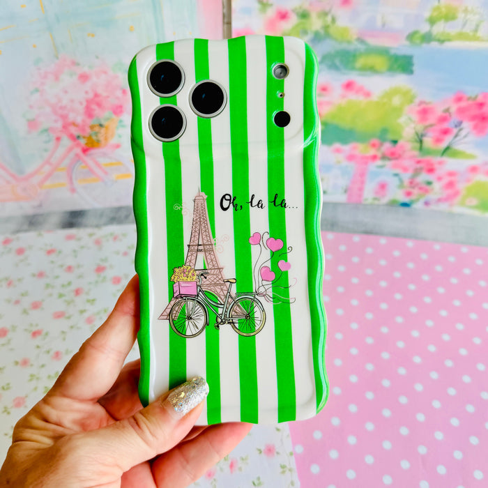 Trendy wavy iPhone case featuring green and white vertical stripes with a central Eiffel Tower and bicycle graphic.
