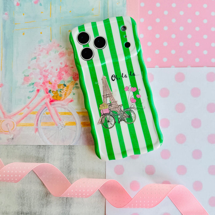 Trendy wavy iPhone case featuring green and white vertical stripes with a central Eiffel Tower and bicycle graphic.