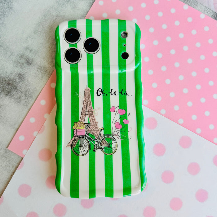 Trendy wavy iPhone case featuring green and white vertical stripes with a central Eiffel Tower and bicycle graphic.