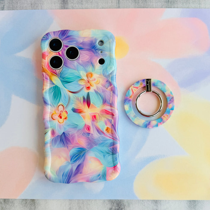 Pastel Paradise iridescent floral MagSafe phone grip ring with glowing lavender blue and coral petals compatible with iPhone and Samsung