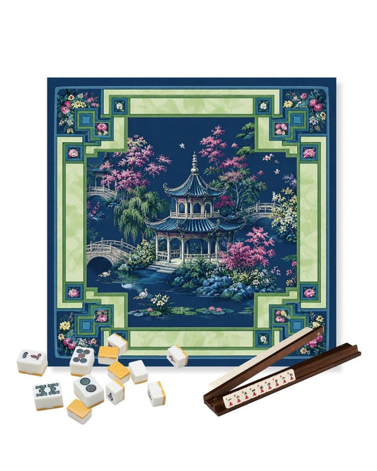 Square gaming table mat with dark blue border, pink blossoms, and central pagoda scene
