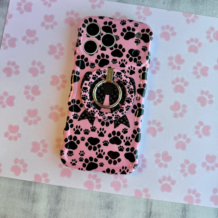 Pretty Little Paws pattern MagSafe phone grip ring with black paw prints on a pink background compatible with iPhone and Samsung