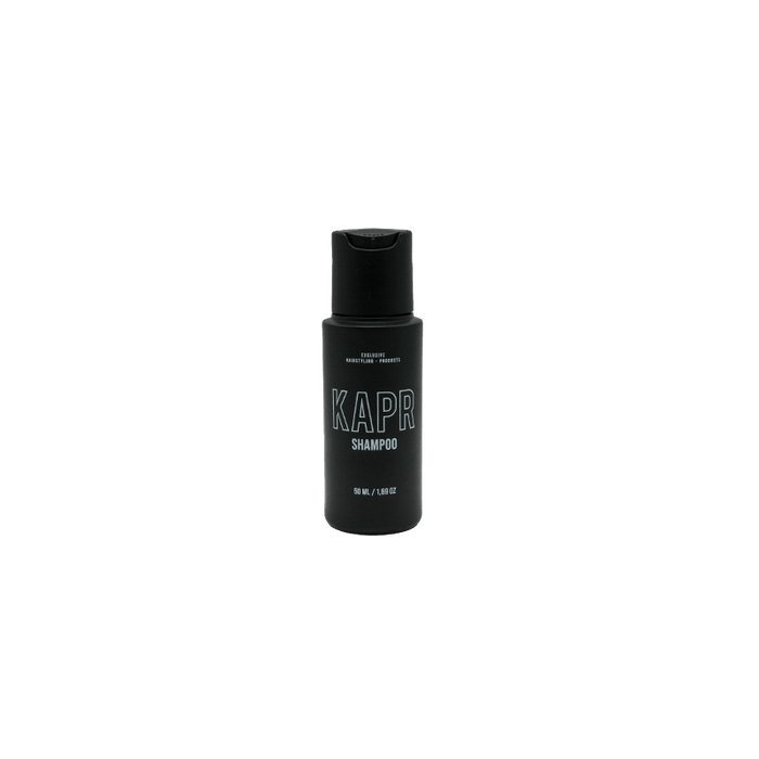 KAPR Face & Beard Wash – zwarte fles met pomp, transparante achtergrond, reinigt gezicht en baard op milde wijze.