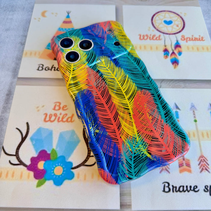 Trendy wavy iPhone case featuring a vibrant layered feather pattern in teal, orange, yellow, and blue with a high-gloss finish.