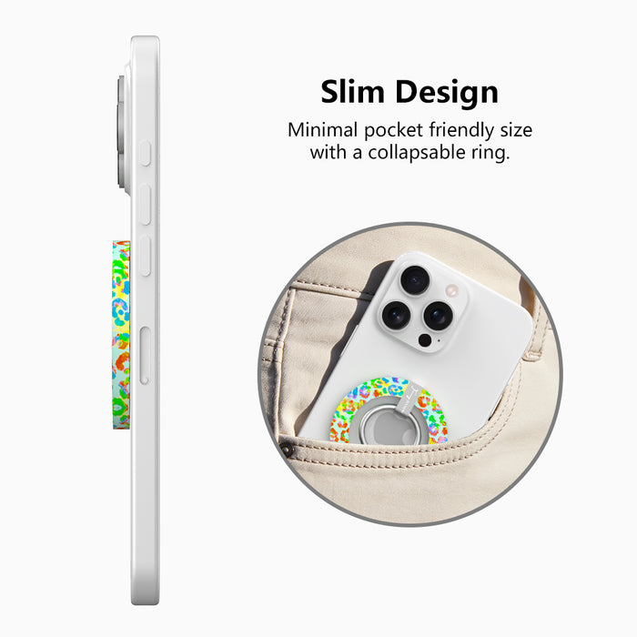 Rainbow Roar Leopard MagSafe phone grip ring with neon multi-colored animal print spots on a mint background compatible with iPhone and Samsung