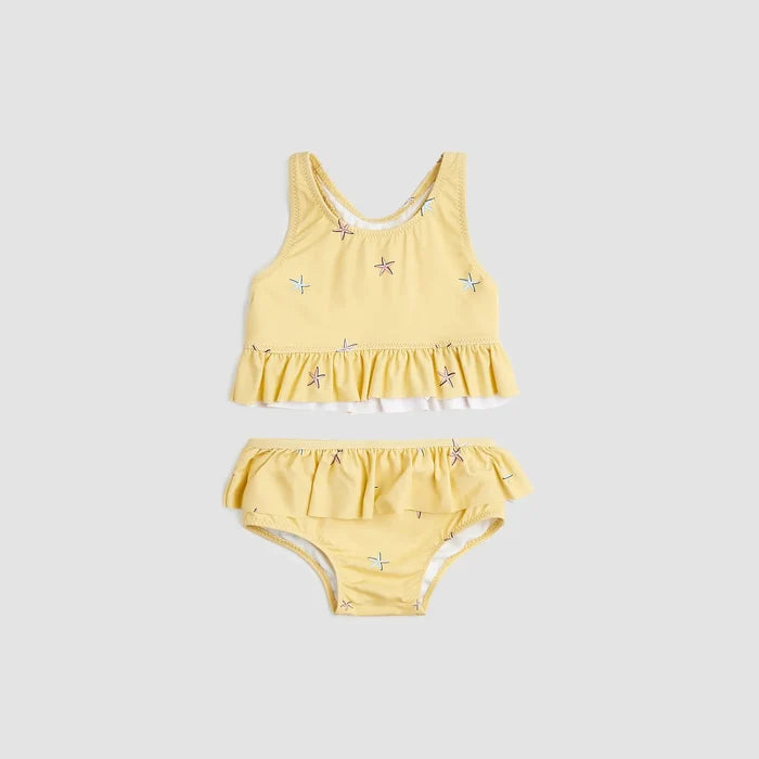 Miles The Label baby girls and girls Sunrise starfish two-piece swimsuit with UPF 50+ and frilly details.