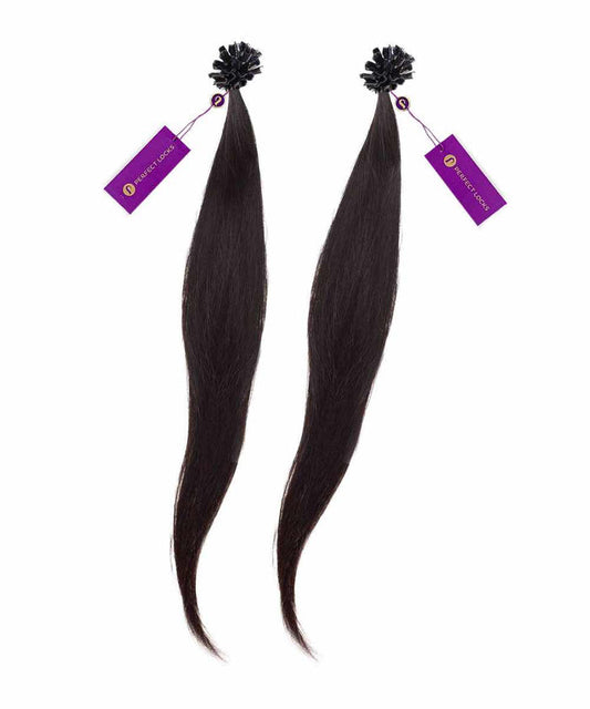 Two long, dark brown wavy hair extensions bundled at the top with a black wrap and purple tag, lying side by side on white.