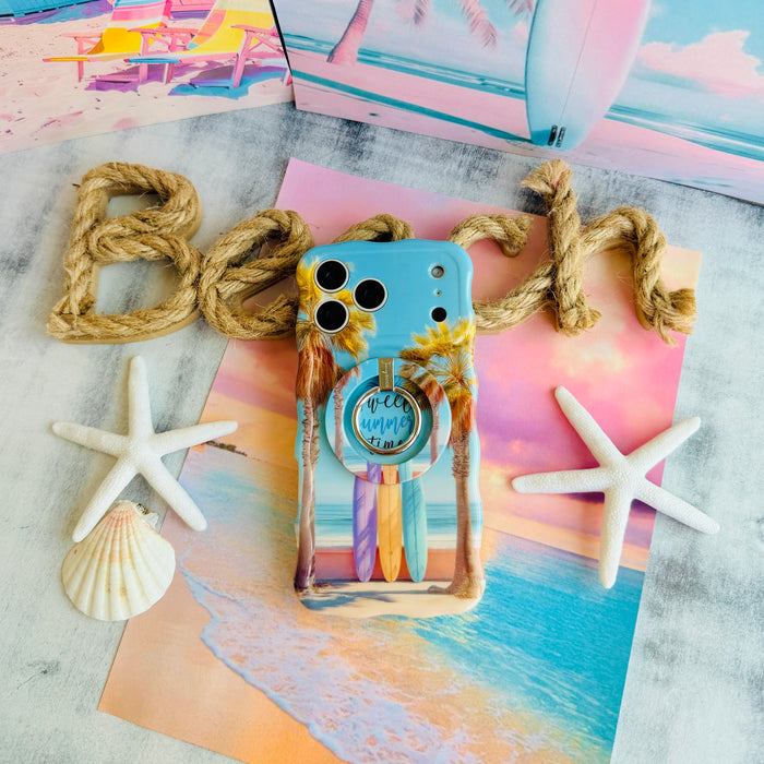 Sweet Summer MagSafe phone grip ring featuring surfboards leaning against palm trees on a tropical beach with ocean waves and a blue sky