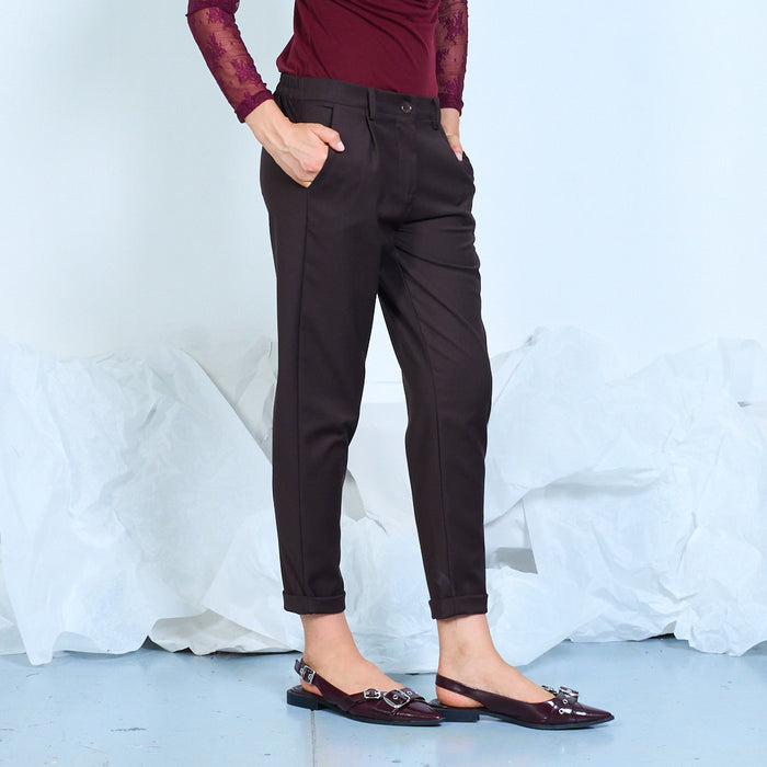 Tapered trousers with cuffed hems and side pockets wholesale