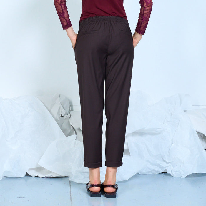 Tapered trousers with cuffed hems and side pockets wholesale