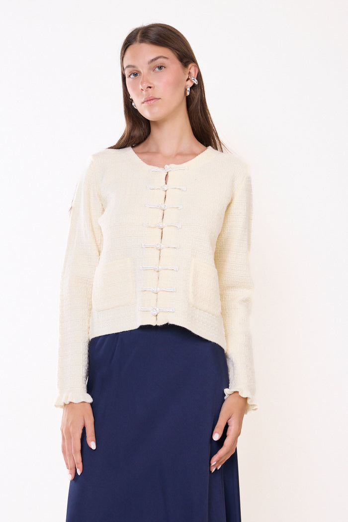 Textured knit cardigan with frog closures and patch pockets wholesale
