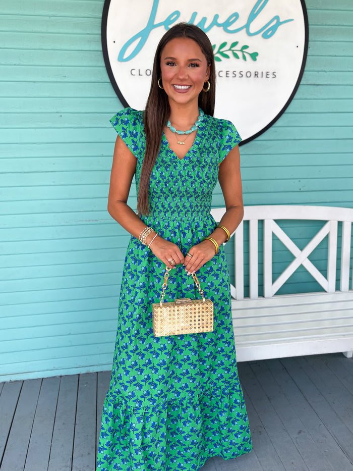 green dress with blue floral pattern
