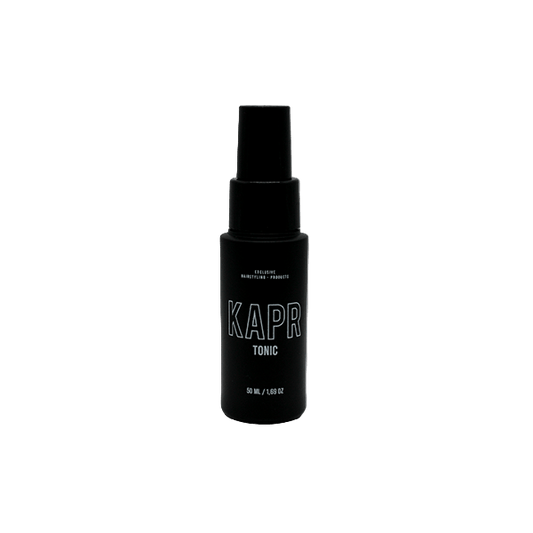 KAPR Tonic – zwarte fles met wit logo op transparante achtergrond, verfrissende haarverzorging.