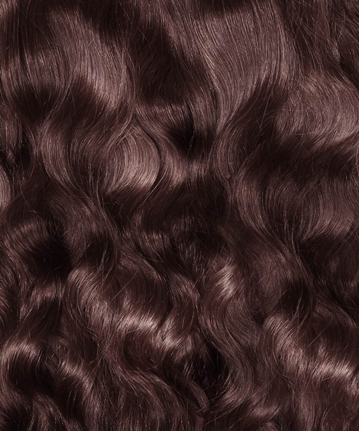 Close-up of Perfect Locks Wavy Classic Clip-In Hair Extensions in Chocolate Brown , with soft curls and a smooth, shiny texture.#color_chocolate-brown-(3)