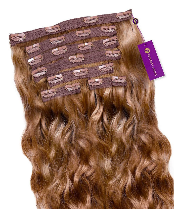 A set of Perfect Locks Wavy Classic Clip-In Hair Extensions in Golden Brown  arranged in a fan shape, clips at the top, purple brand tag.#color_golden-brown-(6)