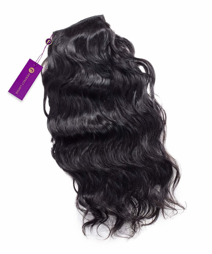 A bundle of Perfect Locks Wavy Virgin Machine Weft hair extensions in natural black , shiny finish, purple PURE LUXE LACE tag.