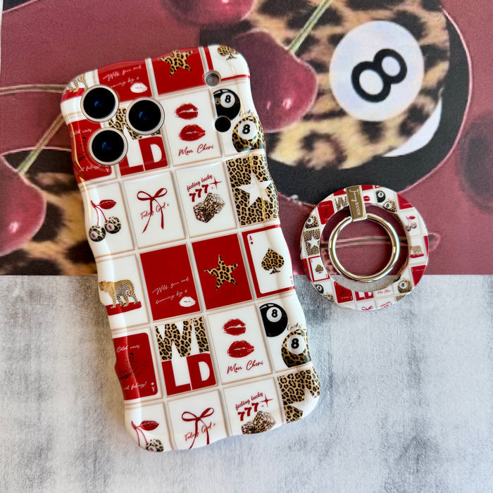 Wild Cherry collage pattern MagSafe phone grip ring with leopard print cherries, 8-balls, and playing cards on a red and white background